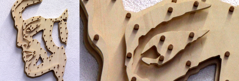 Künstlerische Fräsarbeit, 15 mm Tischlerplatte, 3-lagig, mit Holzdübel verzapft.